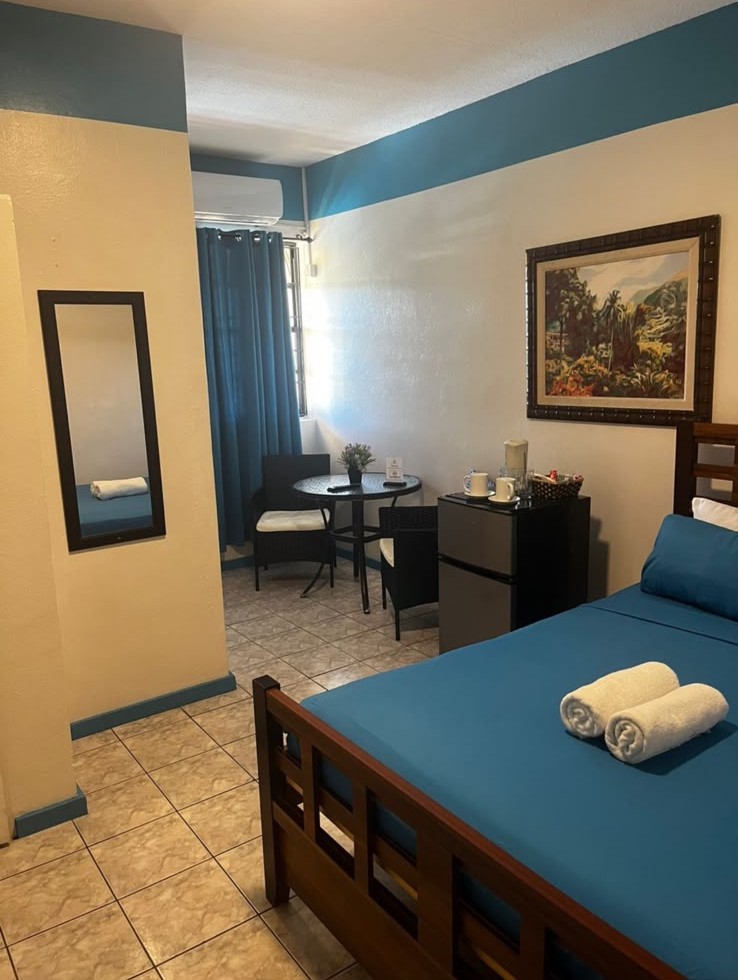 Bright room with bistro table and mini-fridge